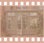 A Town and Country Conservatory featuring arched doors